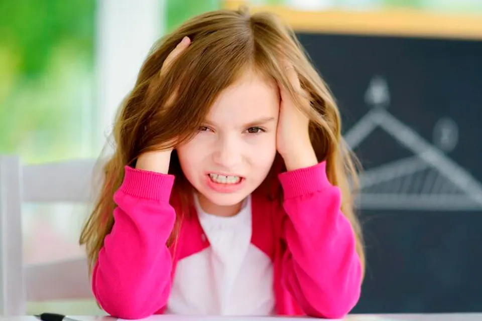 Child playing at a table during an attention support session