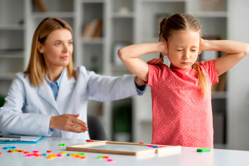 Therapist supporting a child with special needs